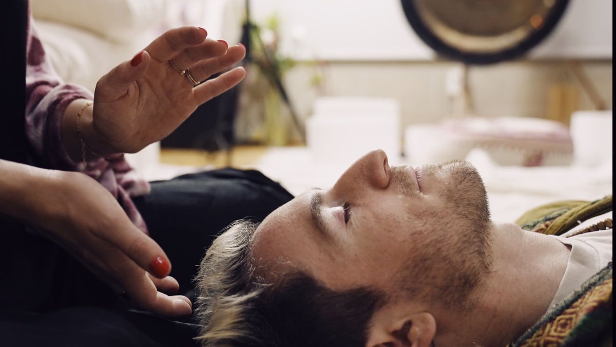 Experiencing the soothing benefits of Reiki post a Pilates session, showcasing the whole-body approach to fitness at our West Hollywood Pilates studio