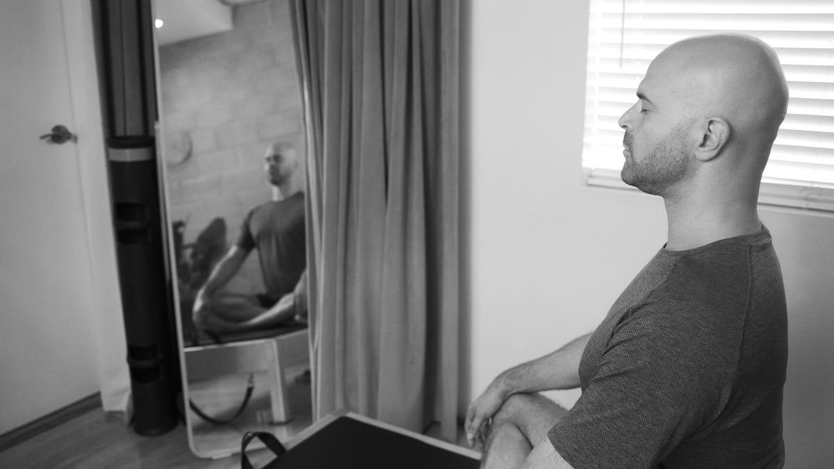 Image of a person practicing Pilates with mindful movement and breathing, embodying relaxation, stress relief, and mental well-being.